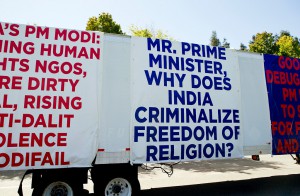 An OMFI (organization for minorities of India) sponsored truck displays signs critical of Indian prime minister Narendra Modi during a protest of the upcoming visit of the prime minister to Google at Charleston Park near the GooglePlex in Mountain View, Calif., on Friday, Sept. 18, 2015. OMFI members oppose Modi's record of genocide and criminalization of religious freedom. (LiPo Ching/Bay Area News Group)
